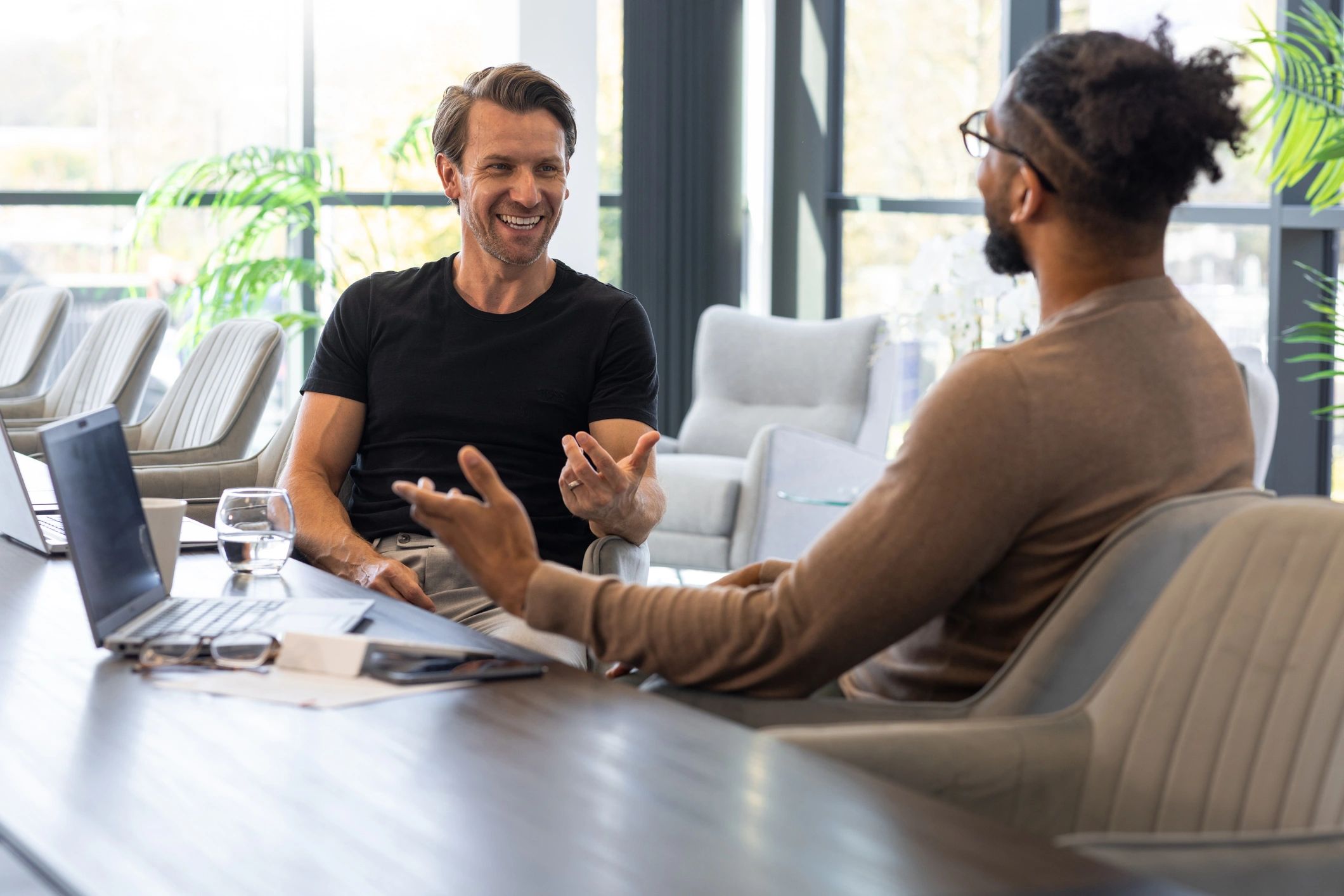 Insurance advisor meeting with a client in a modern office