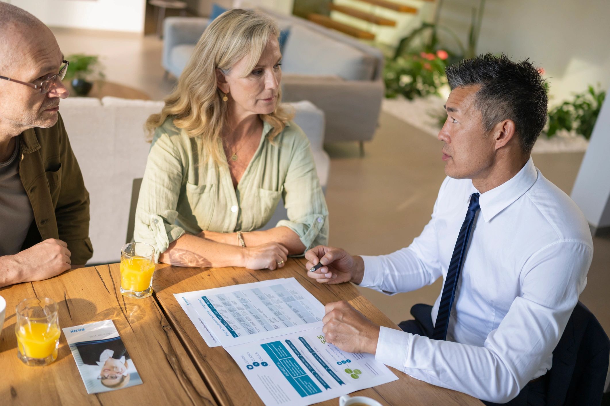 Advisor consulting with clients at a table